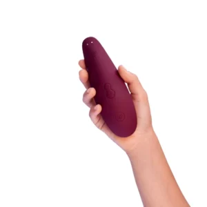 Bordeaux Womanizer Classic 2 Clitoris Sucking Vibrator in palm of hand